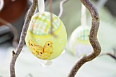 A painted Easter egg on a twig