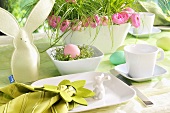 Breakfast place setting with an Easter bunny and an Easter nest