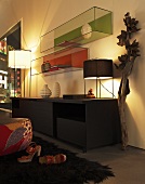 Lighting above a sideboard and a glass tank on a wall