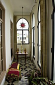 Loggia with oriental style lancet windows and patterned tile floor