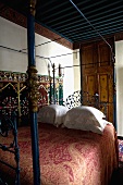 Oriental bedroom with a canopy bed