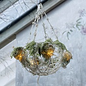 A ceiling lamp with beads and Christmas decoration