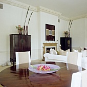 A living room in an English house with antique oriental cupboards