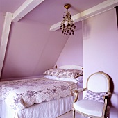 A bedroom in a 19th century German thatched-roof house decorated in a Scandinavian style