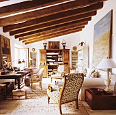 A wood beam ceiling with strong dimensions in a Mediterranean living room