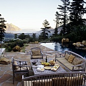 An evening meal on the terrace by the pool with a view of the South African landscape