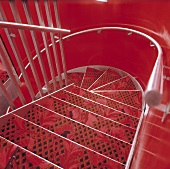 A red stairway - metal stairs covered with a red carpet