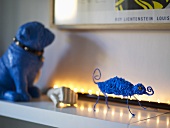 Blue animal figures on a white shelf