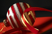 Red and white striped Christmas baubles with ribbon