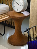 Alarm clock on a rustic wooden side table