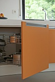 Modern kitchen with orange units