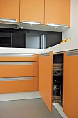 Modern kitchen with orange units