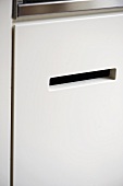 Recessed handle in fitted unit