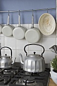 Old fashioned style kettles on gas hob