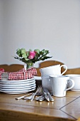 Tableware and cutlery on wooden table