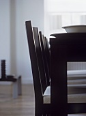 Close up of black dining table and chairs