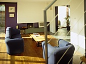 Elevated view of blue upholstered sofa facing coffee table