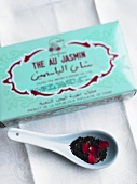 A box and a spoonful of jasmine tea