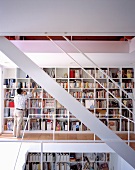 An open stairway with built in bookshelves