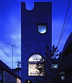 Modern architecture - a tree in front of The Tower House, Tokyo, Japan in the evening