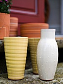 Vases and flowerpots on a stone step