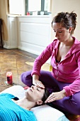 A woman having an oil face massage