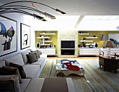 A modern corner sofa and arched stainless steel lamps in a spacious living room