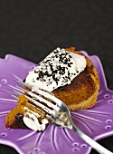 Piece of pumpkin pie with cream and silver dragées