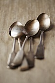 Several antique silver teaspoons