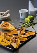 Baked butternut squash on baking tray