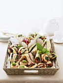 Assorted sandwiches and wraps in a basket