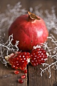 Whole pomegranate and pieces of pomegranate