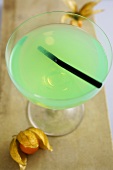 A cocktail made with pistachio syrup, bourbon and lime juice
