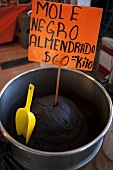 Mole negro almendrados (Mexican almond sauce) at a market