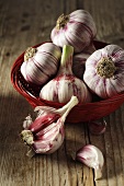 Garlic bulbs in a basket and on the side