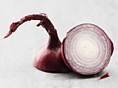 A red onion, halved