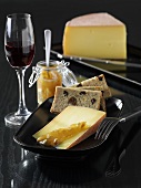 Cheese with jam, bread and red wine