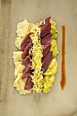 Poached duck breast with herb Fleckerln (Austrian pasta) and fried cabbage
