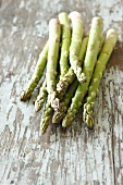 Green asparagus on wooden background