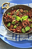 Squid with broad beans and tomatoes (Greece)