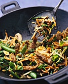 Vegetables and beef in wok