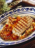 Barbecued tuna on tomato and olive sauce