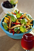 Pasta salad with peppers, olives and basil