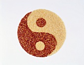 Yin yang with rice and chili, symbolising 'metal'