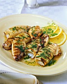 Barbecued squid with butter sauce and parsley