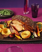 Roast beef with carrots, red onions and potatoes