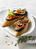 White bread topped with fried aubergines