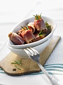 Dates wrapped in bacon and rosemary