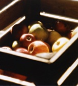 Fresh apples in a wooden crate
