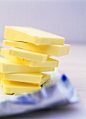 Slices of butter in a pile